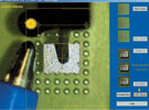 Figure 5. The micro-SMD is placed automatically into the designated CSP-spot (to give an idea of the real size of this unit, the picture includes a view of a ball-pen tip)